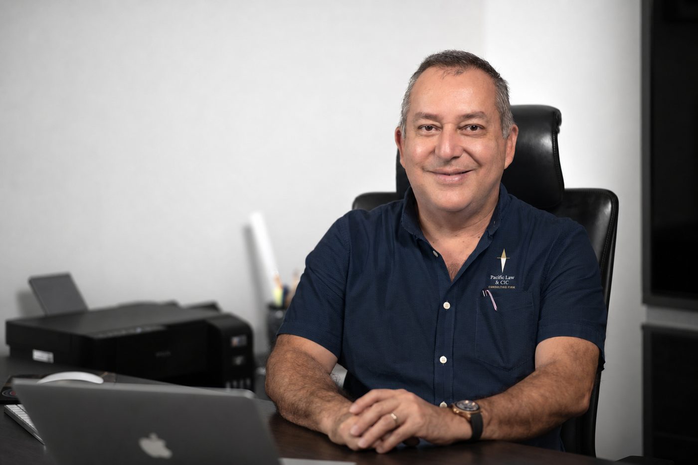 A member of the Pacific Law & CIC team at his desk